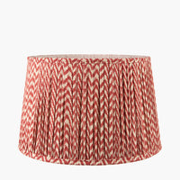 Beautifully pleated, chevron patterned lamp shade in red and off white colouring.
Available in 5 sizes.
