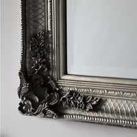 Classic silver leaner mirror with period carved decoration.  A large roccoco framed mirror in silver with a classic ornate look.  A great hall mirror, this size will add a lot of light and pespective to any entryway.   Great in a dressing room, leaning or hanging on a wall. In your living room to add statement glamour to your room.