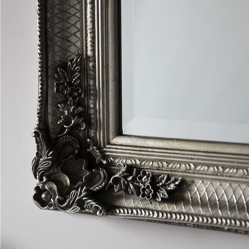 Classic silver leaner mirror with period carved decoration.  A large roccoco framed mirror in silver with a classic ornate look.  A great hall mirror, this size will add a lot of light and pespective to any entryway.   Great in a dressing room, leaning or hanging on a wall. In your living room to add statement glamour to your room.