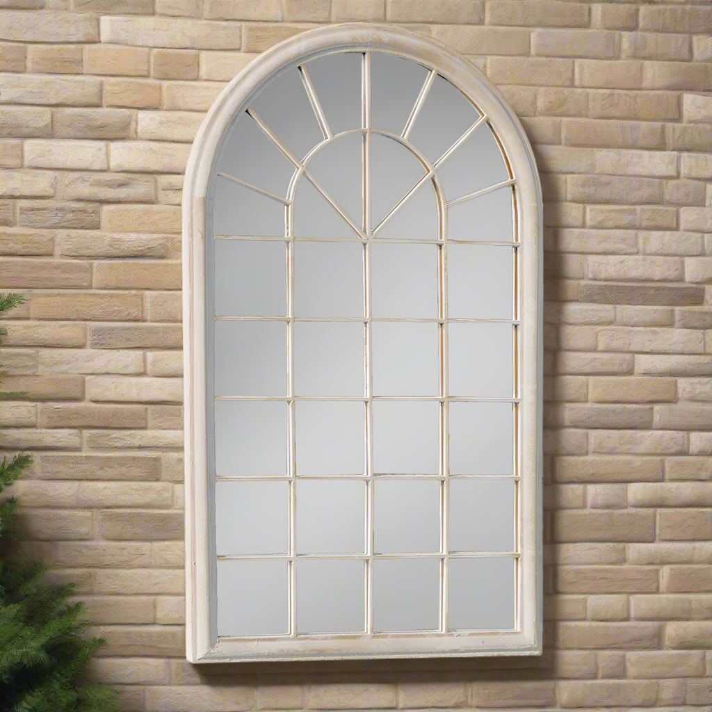 Outdoor window mirror in a stone aged painted finish. Perfect Garden Mirror.  This arched metal window mirror will open up your space and bring light into your open area.  Suitable for outdoors, on a patio wall or fence, conservatory.  Align in a row for maximum effect.  This is a very pretty effective way to decorate and enhance your garden, balcony, patio or conservatory space.  Use indoors or outside.
