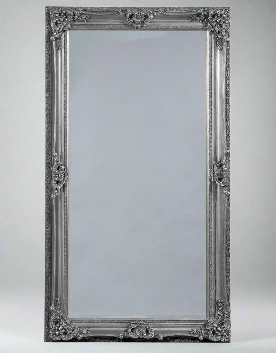 Extra large silver swept framed mirror.  A hug mirror that will just add masses of light to any room, can be leant against the wall or hung. The sale of this mirror endures that it will work in any room, in a hall, bedroom, dressing room and perfect in a living room.  The frame is a muted silver so will work well in most interiors. a really grand statement.