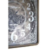 Moving cog clock in antiqued mirrored finish with square gilt metal frame.