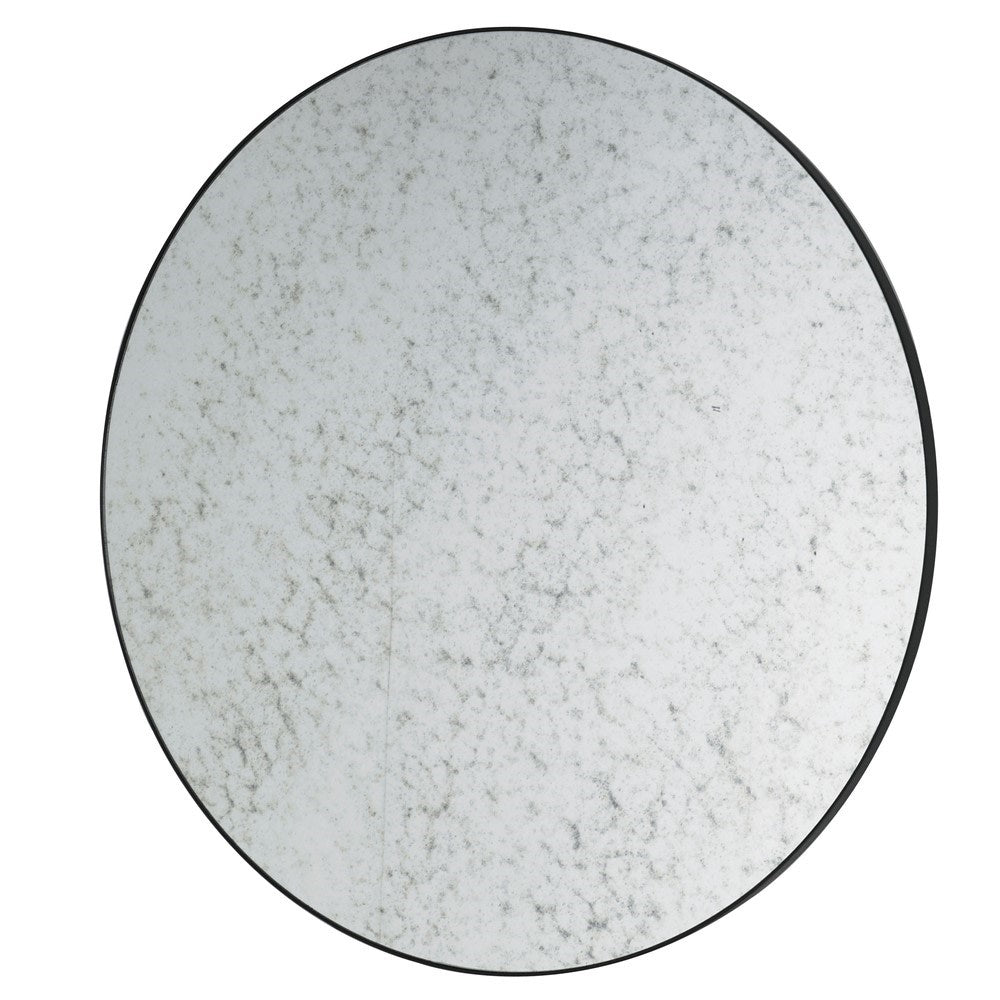 Circular aged black rimmed mirror.  A simple iron frame with aged Venetian glass makes this a feature mirror for spaces that need to be lit up without a domineering reflection.
