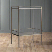 A side table with a marble top and a shelf in a soft champagne metal finish. A luxurious addition for any room.