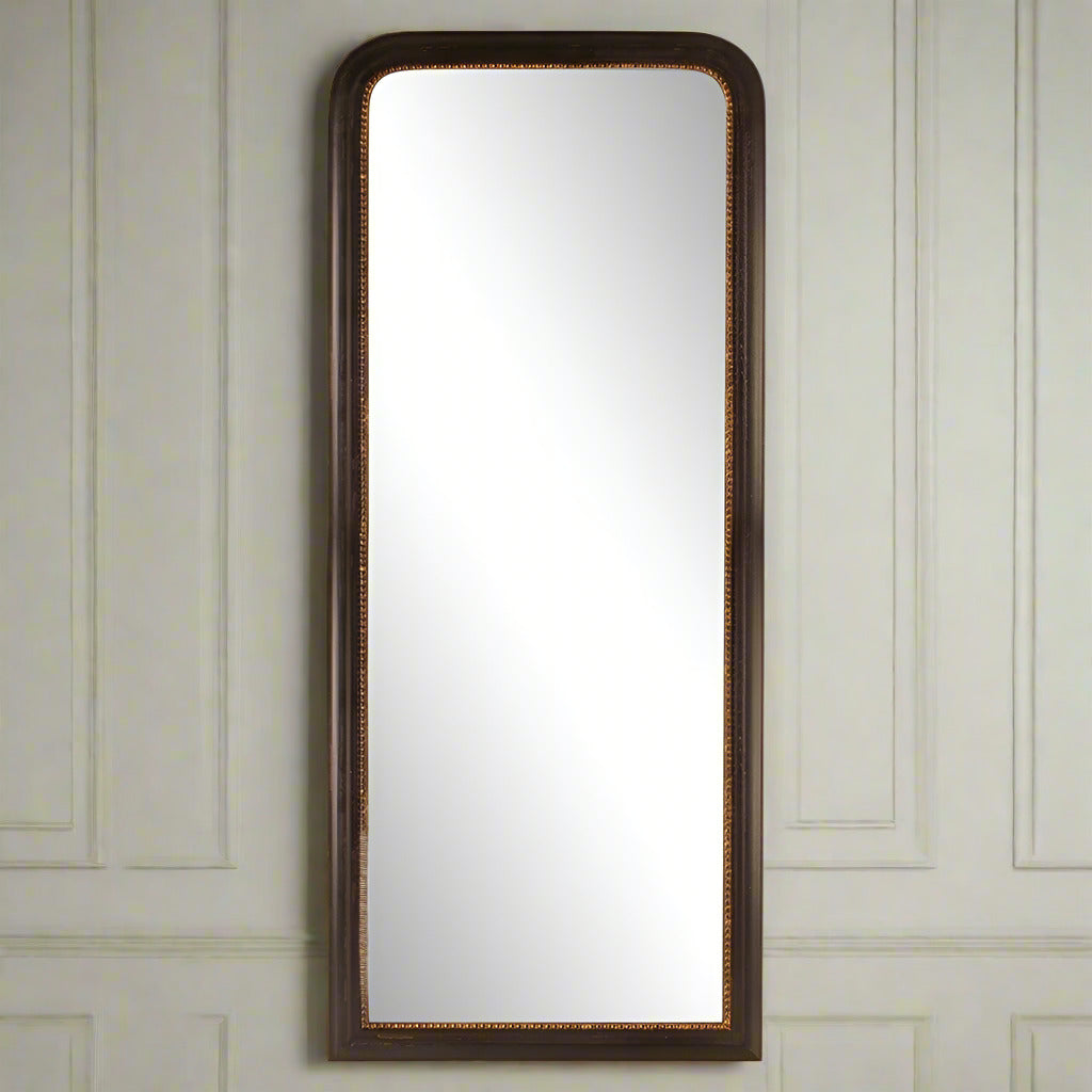 Black painted mirror with gold beaded inset.  To lean or hang on a wall, this full length mirror is perfect in a hall, bedroom in any room. Black mirrors, especially with an inner rim of gold have a stylish effect on any room, dramatic and adding a contemporary feel. This mirror can be wall mounted or is tall enough to lean against a wall, A bold statment in your living room, functional and decorative.