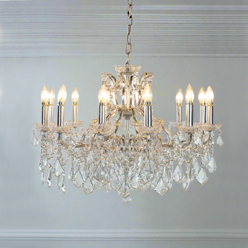 The silver frame of this large crystal chandelier is antiqued to give a softer feel, covered in huge amount of crystals on the rubbed silver base, an absolutely stunning light. The classic shape suits any interior but is perfect in a period home.