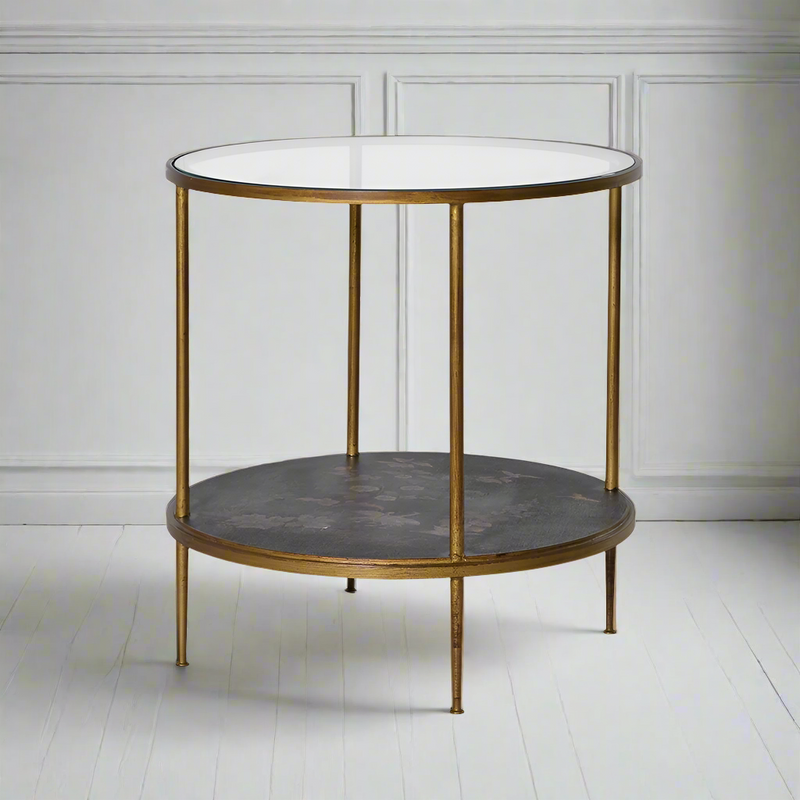 Two-tier side table with a glass top and lacquered lower shelf featuring a Japanese-inspired design of cranes and cherry blossoms, supported by a gold-tone metal frame.