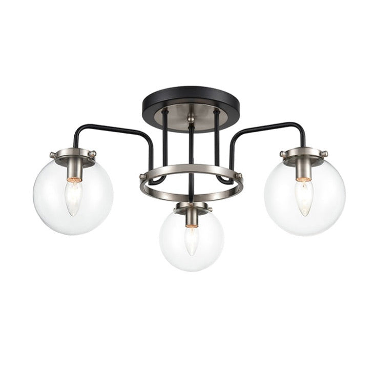 3 Glass globe semi- flush industrial style light, set in nickel metal frame. This semi-flush pendant it in a black and nickle finish so would look just as stunning in a contemporary home.