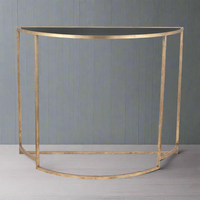 Gilt metal half moon style console table with black glass top. Perfect for the smaller space, on a landing or small hall.&nbsp;