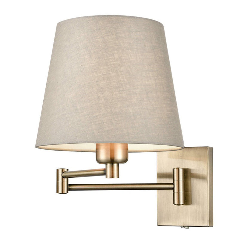 A contemporary adjustable wall light combining a brass metal frame with a softly tapered neutral linen shade.