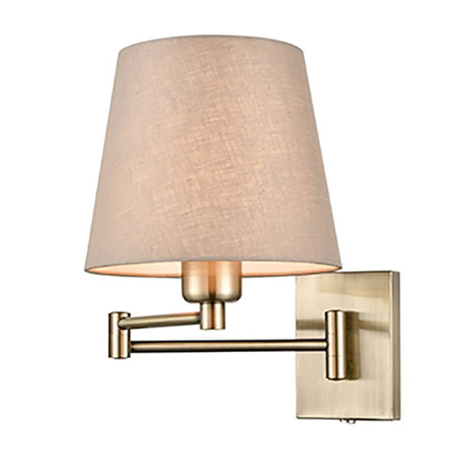 A modern wall-mounted sconce with a tapered beige linen shade and a brushed brass adjustable arm and square wall plate, 