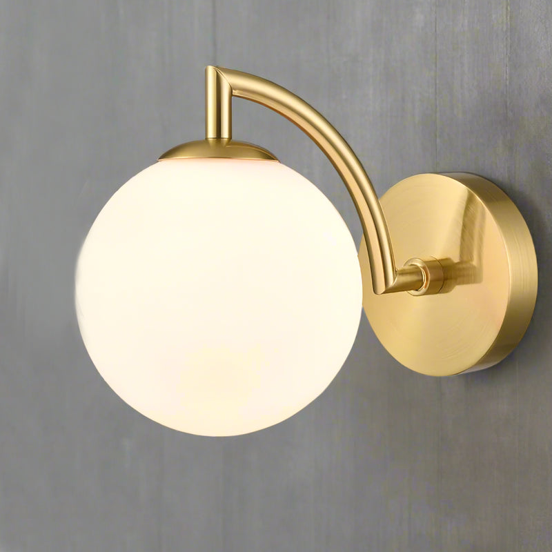 Stylish aged brass wall light with a sphere shaped opal glass. It creates an instant classy and elegant feel. With an IP Rating 44, it can be use in the bathroom transforming your space with a glamorous look.


H: 16 cm W: 12 cm 