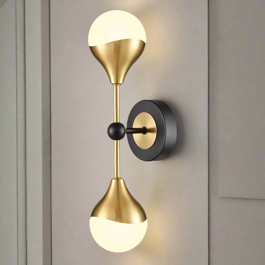 Really stylish brushed gilt and matt black metal fixtures with two round opal glass fittings creating an instant classy and elegant feel. Exceptionally stylish light with scalloped effect to the metal on the glass.