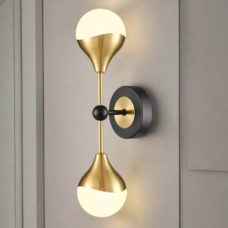 Really stylish brushed gilt and matt black metal fixtures with two round opal glass fittings creating an instant classy and elegant feel. Exceptionally stylish light with scalloped effect to the metal on the glass.