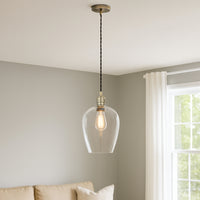 Tall clear glass pendant with brass fitting and black twisted flex.&nbsp; These are extra large glass pendants, perfect grouped over an island in the kitchen, on a stairwell or in a hall.