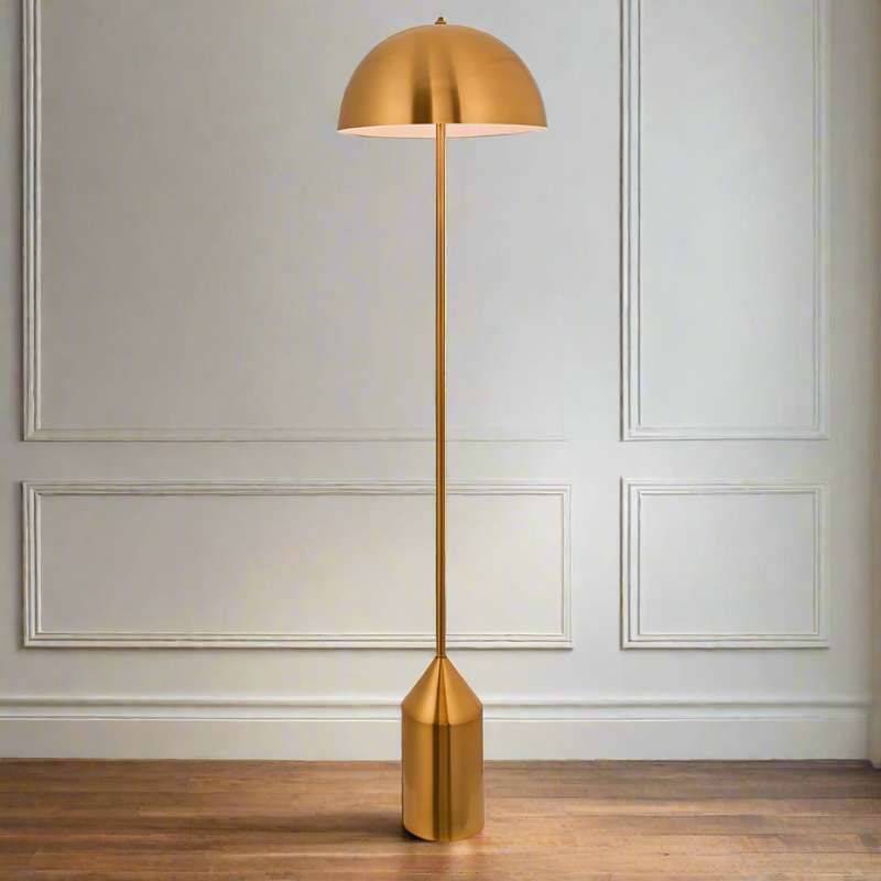 Dome shaded floor lamp, a tall gilt meta floor lamp in a reflective antique brass colour. Contemporary lines in a classic shaped light. Great in a bedroom or sitting room to give extra light and atmosphere to your space.


H: 152 cm W:&nbsp; 40 cm D: 40 cm