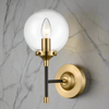 This stylish antique gold and matt black wall light with a clear glass sphere , perfect for contemporary or classic settings , statement wall lighting.