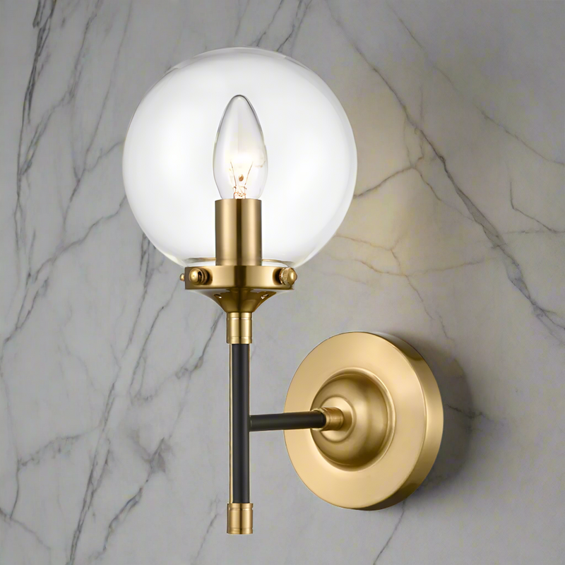 This stylish antique gold and matt black wall light with a clear glass sphere , perfect for contemporary or classic settings , statement wall lighting.