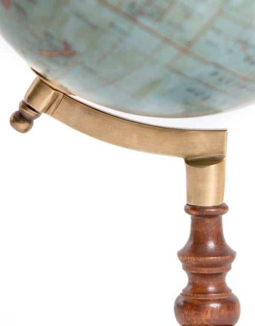 Antique rotating world globe on a wooden stand. A perfect gift for a library space.
