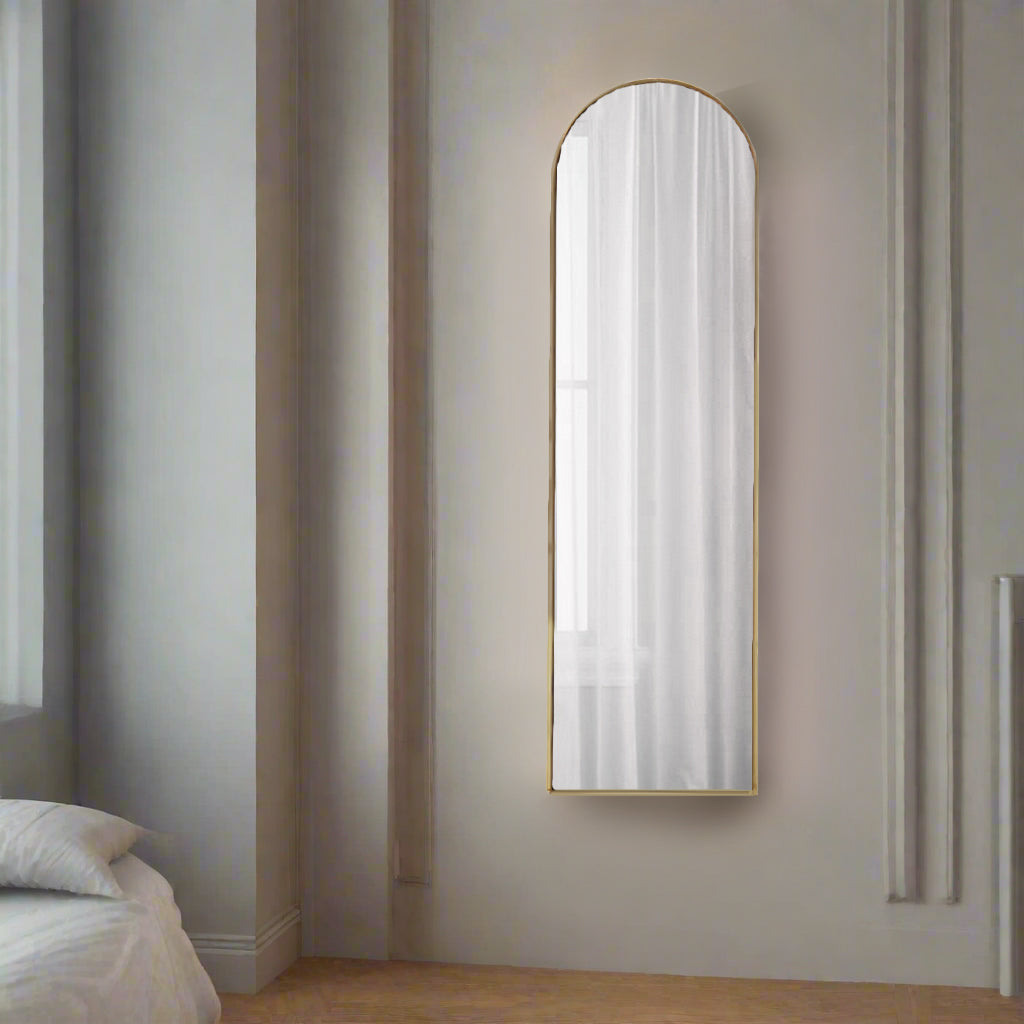 Tall, slim arched mirror in a minimal gilt frame, simple but very effective, Slim enough for the darkest corner, add extra light and perspective. Perfect in a dressing room, bedroom or hall when you need a last look as you leave the house.


H: 100 cm W: 29 cm