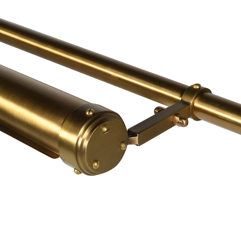 Elevate your artwork or wall décor with this elegant brass picture light, designed for both function and timeless style. Featuring a sleek cylindrical light bar in a warm brass finish, it casts an even, flattering glow across your painting or photograph. The fixture is mounted on a central pole, from which two decorative brass chains extend to secure it to the frame or wall, ensuring both stability and a sophisticated look.

Perfect for galleries, living rooms, or hallways, this brass picture light highligh