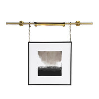 Elevate your artwork or wall décor with this elegant brass picture light, designed for both function and timeless style. Featuring a sleek cylindrical light bar in a warm brass finish, it casts an even, flattering glow across your painting or photograph. The fixture is mounted on a central pole, from which two decorative brass chains extend to secure it to the frame or wall, ensuring both stability and a sophisticated look.

Perfect for galleries, living rooms, or hallways, this brass picture light highligh
