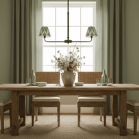 A refined ceiling light featuring an matt black frame with two curved arms, each supporting a classic tapered fabric clip shade/