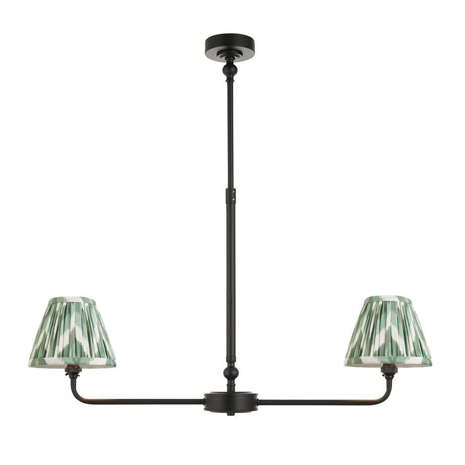 A refined ceiling light featuring an matt black frame with two curved arms, each supporting a classic tapered fabric clip shade.