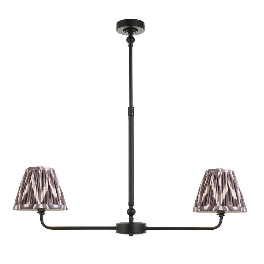 A refined ceiling light featuring an matt black frame with two gently curved arms, each supporting a classic tapered fabric clip shade.