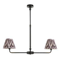 A refined ceiling light featuring an matt black frame with two gently curved arms, each supporting a classic tapered fabric clip shade.