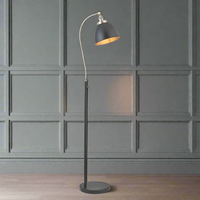 Tall slim profiled, black floor lamp with nickel fittings and gilt inner to the black shade. This lamp is great for a study or to read by, placed by a desk or your favourite chair the light can be directed where it's needed.