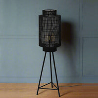 .Black wire basket floor lamp. Exceptionally stylish standing lamp with an industrial twist. This lamp would be perfect in a living room, a study any room which would benefit from an unusual focal point.