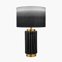 Ceramic black and gold lamp base in a striking black with gold accents.&nbsp; The lamp is topped with a very unusual ombre lampshade toning from black to grey.