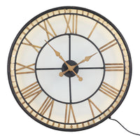 This is an indoor clock where the hands are operated by two standard AA batteries.&nbsp; The iron fascia and hands sit on top of a smoked glass.&nbsp; The batteries are housed in the middle behind the hands - the cross section of which can be pulled out for access.&nbsp;  An led strip light inside requires a power / three pin plug socket.&nbsp;