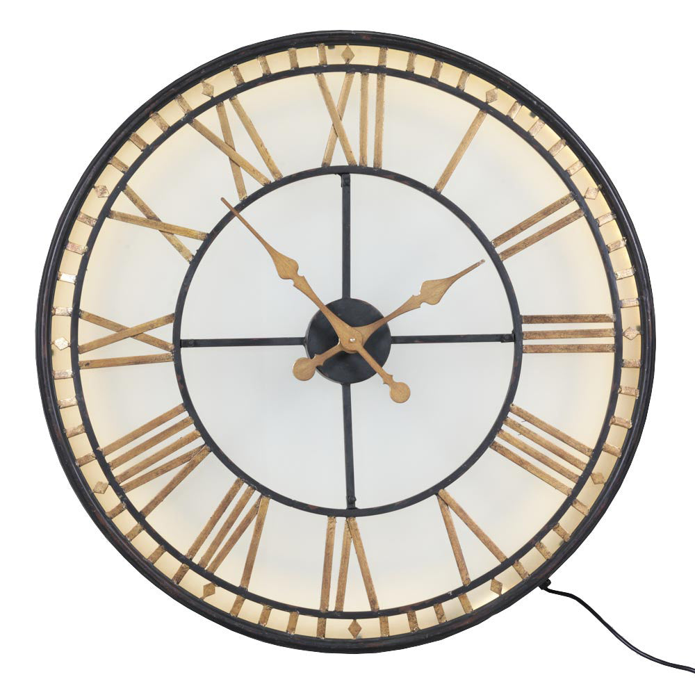 This is an indoor clock where the hands are operated by two standard AA batteries.&nbsp; The iron fascia and hands sit on top of a smoked glass.&nbsp; The batteries are housed in the middle behind the hands - the cross section of which can be pulled out for access.&nbsp;  An led strip light inside requires a power / three pin plug socket.&nbsp;
