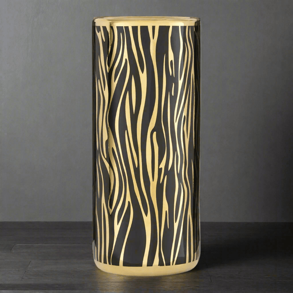 A stunningly patterned ceramic umbrella stand in a black and gold animal stripe. A luxurious addition to your hall, yet practical holding the family umbrellas.&nbsp; A very glamorous ceramic umbrella holder, the black and gold stripes will really add a touch of luxury to your hall. Ceramic umbrella stands are a perfect way to declutter the entrance to your home, We have a wide range of ceramic umbrella stands on our website in many different colours. Well worth taking a look at our range of ceramic umbrella