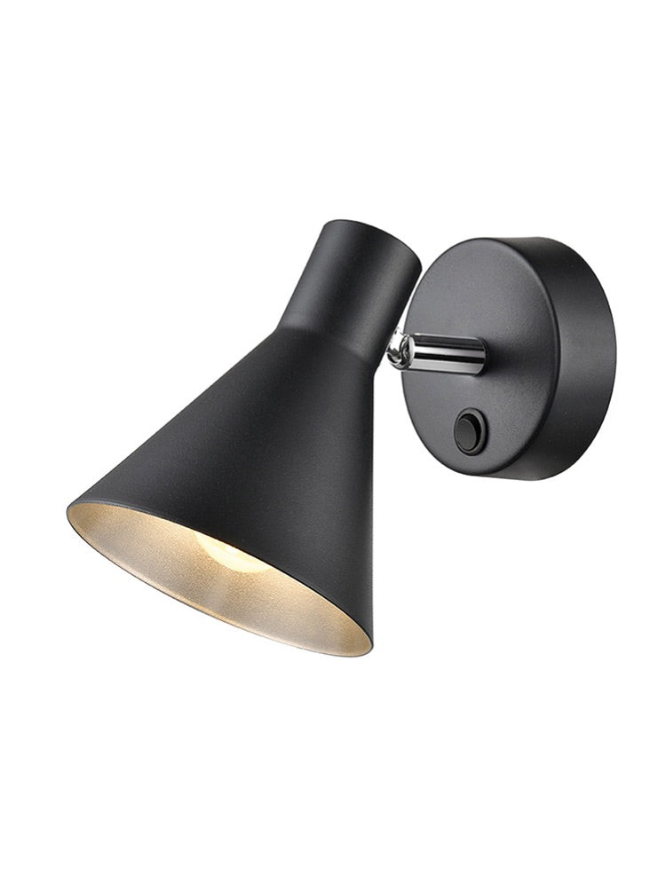 Cone shaped matt black wall light with silver&nbsp; coloured inner.&nbsp; A single wall light with an integral switch.&nbsp; The spotlight has a full range of motions and can be positioned by hand. The silvered finish on the inside of the spotlight offers a warm glow wherever it is placed.