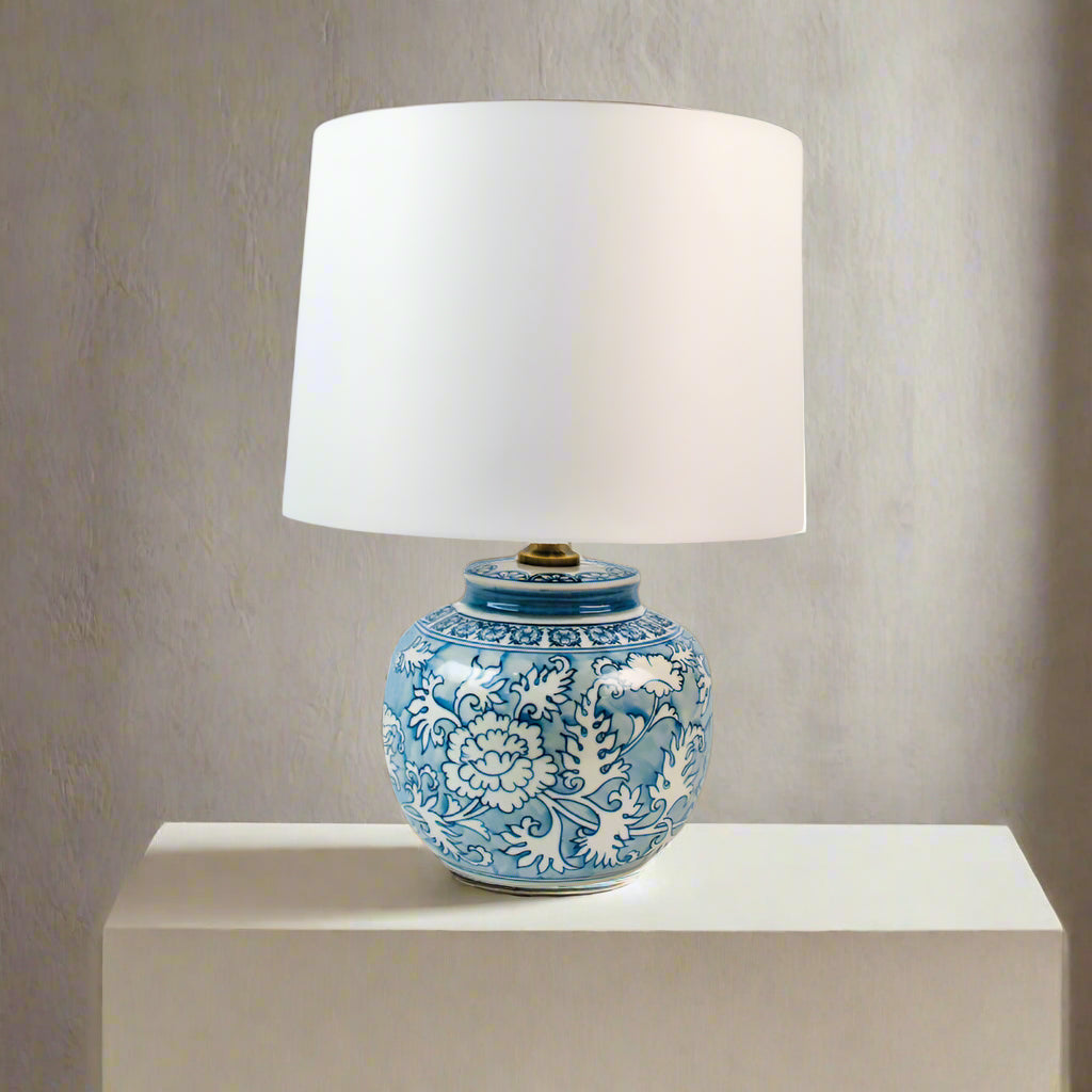A really pretty smaller blue and white round based ceramic lamp with white shade. Perfect size for a smaller space, or a bedside lamp.