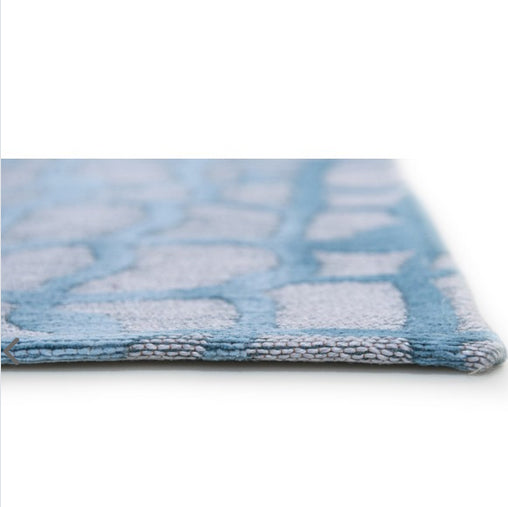 A contemporary blue and grey rug designed to add subtle texture and calm colour to your space. 