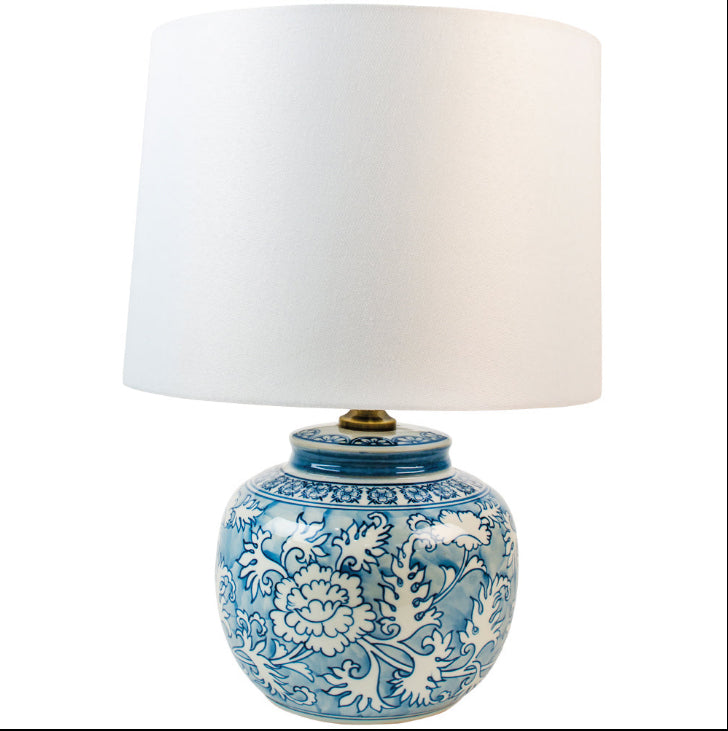 A really pretty smaller blue and white round based ceramic lamp with white shade. Perfect size for a smaller space, or a bedside lamp.