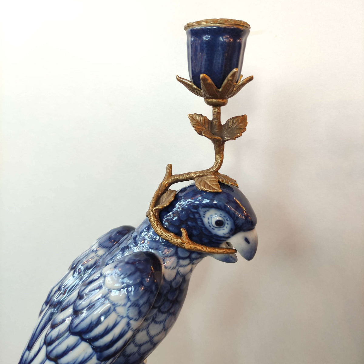 Bronze and porcelain parrot candle holders which are an exquisite reproduction of the Georgian originals. Beautifully made with the coloured porcelain parrots, topped with a bronze candle holder.