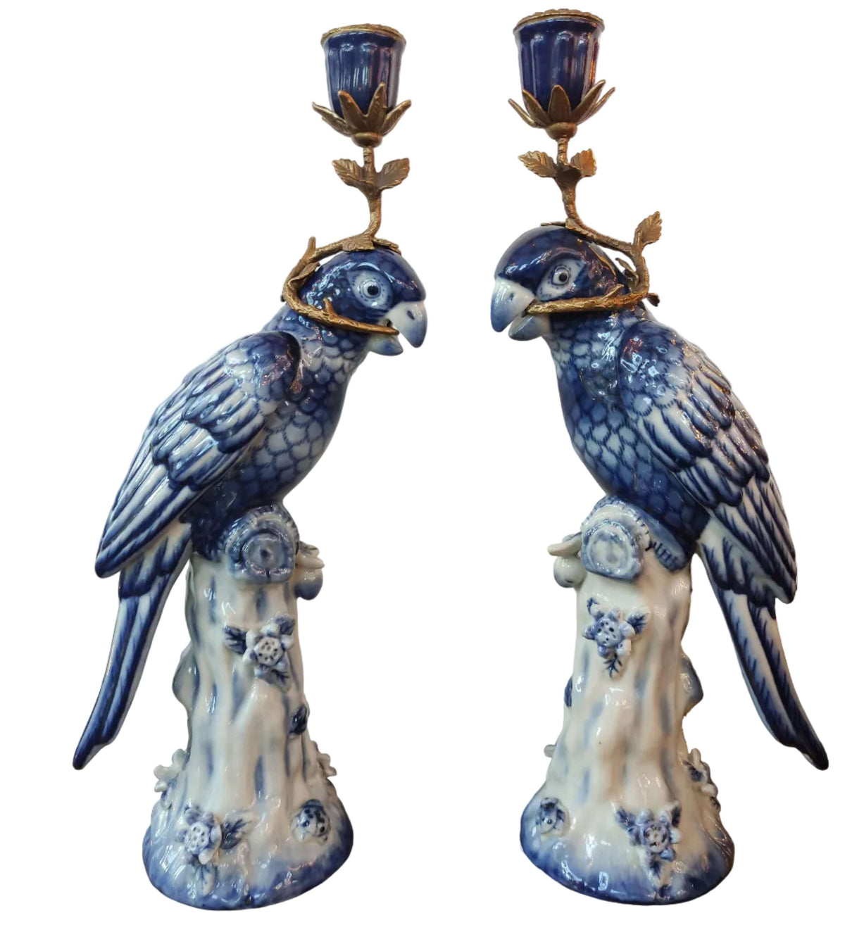 Bronze and porcelain parrot candle holders which are an exquisite reproduction of the Georgian originals. Beautifully made with the coloured porcelain parrots, topped with a bronze candle holder.