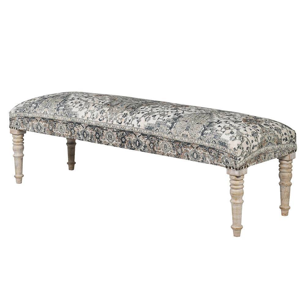 A blue patterned bench on turned limewashed legs. This bench would look perfecet placed at the end of a bed, in a hall for removing shoes etc. or anywhere extra seating is needed. In a neutral pale blue line fabric, the bench is a neutral colour which woul fit perfectly into many interiors. 