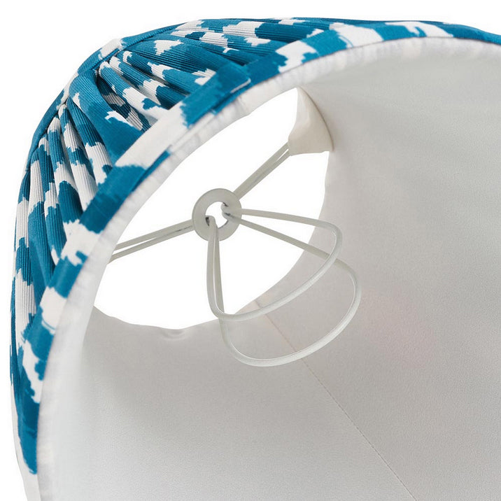 16cm tapered shade with a clip to fit golf or candle bulbs. Unique Ikat pattern design in blue &amp; white with tapered edge detailing.
Perfect when paired with decorative table lights, wall lights or chandeliers.