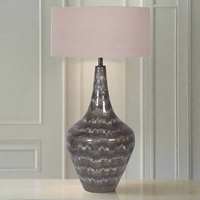 A beautifully shaped tall blue mottled metal lamp base and contemporary round fabric shade. Stylish lamp in a subtle mixture of colours with a beautiful pale coloured shade. A total statement in your living room.