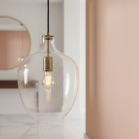 Glass pendant with subtle bubble effect to the glass and pale gilt metal accents. Large enough for any room giving a stunning glow when teamed with a filament bulb.