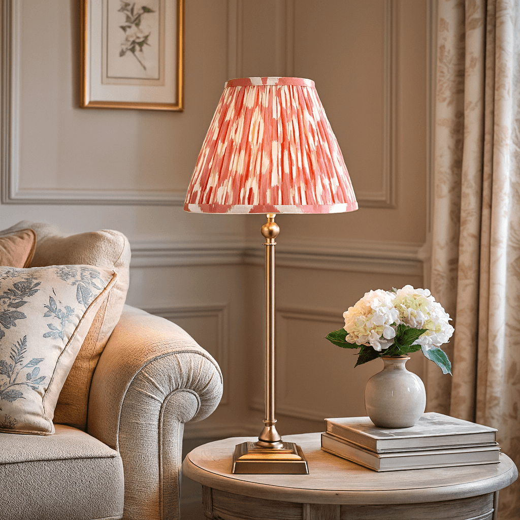 Brass table lamp with red Ikat shade on wooden side table in elegant living room