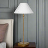 Bring timeless elegance to your bedroom with this bedside table lamp, designed to add both style and functionality to your nightstand. Featuring a slim antique brass base and a crisp white fabric lampshade, this lamp creates a warm, soft glow—perfect for reading before bed or creating a cozy bedroom atmosphere.

Its tall, space-saving design makes it an ideal nightstand lamp for small or large bedside tables, while the neutral color palette complements both modern and traditional bedroom décor. Whether you 