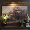 Elevate your artwork or wall décor with this elegant brass picture light, designed for both function and timeless style. Featuring a sleek cylindrical light bar in a warm brass finish, it casts an even, flattering glow across your painting or photograph. The fixture is mounted on a central pole, from which two decorative brass chains extend to secure it to the frame or wall, ensuring both stability and a sophisticated look.

Perfect for galleries, living rooms, or hallways, this brass picture light highligh