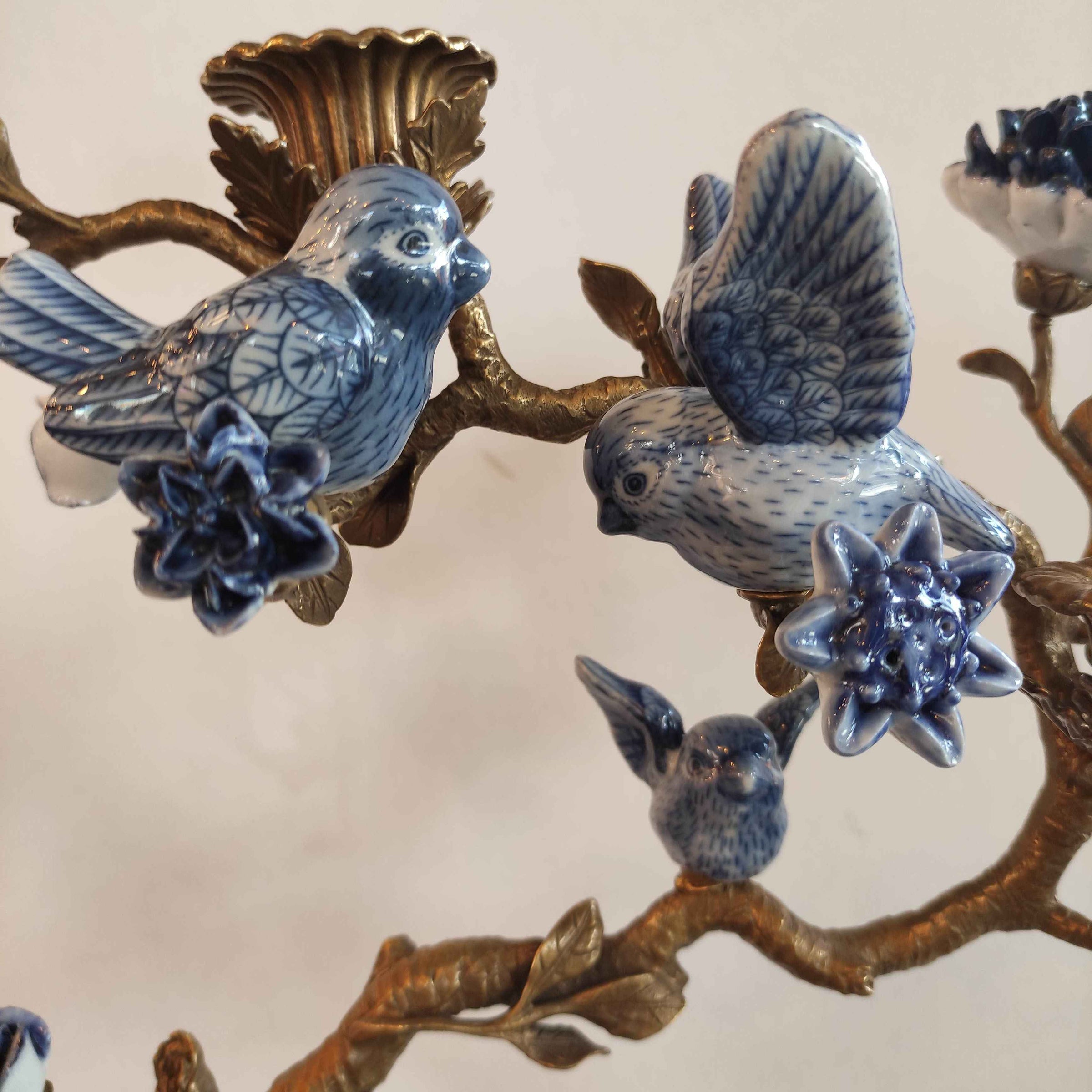 Bronze Bird Candelabra are a luxurious fusion of blue and white porcelain and gleaming bronze. 